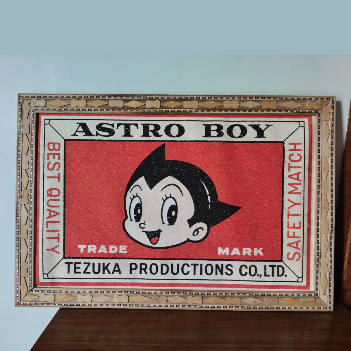 Astro Boy retro matchbox poster with crafted wooden frame.